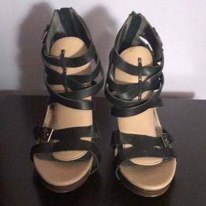 Tan and black buckle heels